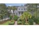 Beautiful home exterior with a welcoming front porch and well-manicured landscaping at 303 S Ladd Ct, Charleston, SC 29492