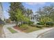 Charming home exterior with a welcoming front porch and lush landscaping on corner lot at 303 S Ladd Ct, Charleston, SC 29492