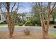 Charming home exterior with a welcoming front porch and beautiful landscaping at 303 S Ladd Ct, Charleston, SC 29492