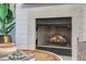 Close-up of a cozy fireplace with modern stone and hearth, creating an inviting ambiance at 303 S Ladd Ct, Charleston, SC 29492