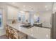 Spacious kitchen with stone countertops, a large island, modern appliances, and bar seating at 303 S Ladd Ct, Charleston, SC 29492