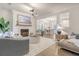 Inviting living room with a fireplace, seamless flow to dining, and comfortable seating at 303 S Ladd Ct, Charleston, SC 29492