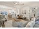 Open-concept living room boasts hardwood floors, modern lighting, and stylish furnishings at 303 S Ladd Ct, Charleston, SC 29492