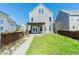 Backyard with green grass, fencing, and patio with a view of the home at 309 Peters Creek Dr, Summerville, SC 29486