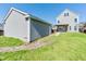 The backyard features a well-kept lawn, a detached garage with horizontal siding, and a pathway to the house at 309 Peters Creek Dr, Summerville, SC 29486