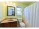 Bathroom with a modern vanity, a framed mirror, and a shower with a curtain at 309 Peters Creek Dr, Summerville, SC 29486