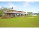 Expansive community gathering space with a covered pavilion, picnic tables, and green lawns for social events at 309 Peters Creek Dr, Summerville, SC 29486