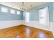 Dining room featuring hardwood floors, wainscoting and three windows at 309 Peters Creek Dr, Summerville, SC 29486