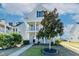 Charming two-story home with double porches and a landscaped front yard at 309 Peters Creek Dr, Summerville, SC 29486