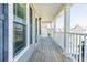 Spacious front porch with wood decking and views of the neighborhood at 309 Peters Creek Dr, Summerville, SC 29486