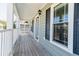 Inviting front porch with wood decking, stylish lighting, and a welcoming entrance at 309 Peters Creek Dr, Summerville, SC 29486
