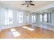 Open living room featuring hardwood floors, natural light, and access to dining area at 309 Peters Creek Dr, Summerville, SC 29486