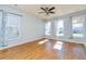 Bright living room with hardwood floors, a ceiling fan, and multiple windows at 309 Peters Creek Dr, Summerville, SC 29486