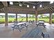 Community pavilion featuring picnic tables, ceiling fans, and an overhead structure for shade and comfort at 309 Peters Creek Dr, Summerville, SC 29486