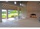 Open-air community pavilion with a brick fireplace, picnic table, and a vaulted ceiling for gatherings and relaxation at 309 Peters Creek Dr, Summerville, SC 29486