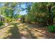 Expansive backyard with mature trees and lush grass, perfect for outdoor activities and enjoying nature at 328 Fern House Walk, Mount Pleasant, SC 29464