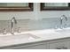 Bathroom vanity featuring marble countertops, tile backsplash, and modern faucets at 328 Fern House Walk, Mount Pleasant, SC 29464