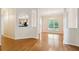 Formal dining area with archway to kitchen and beautiful window overlooking backyard at 328 Fern House Walk, Mount Pleasant, SC 29464
