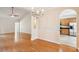 Open dining room area leading into kitchen area with hardwood floors at 328 Fern House Walk, Mount Pleasant, SC 29464