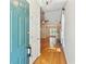 Bright entryway featuring hardwood floors, a chandelier, and a view into the dining room at 328 Fern House Walk, Mount Pleasant, SC 29464