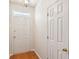 Clean and bright hallway features hardwood floors, neutral walls, and a classic white door at 328 Fern House Walk, Mount Pleasant, SC 29464