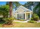 Inviting home with lush landscaping and a manicured lawn providing shade and curb appeal at 328 Fern House Walk, Mount Pleasant, SC 29464