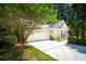 This home boasts an attached garage and driveway, complemented by a lush green lawn and mature landscaping at 328 Fern House Walk, Mount Pleasant, SC 29464