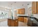 Bright kitchen boasts stainless steel appliances, central island, and granite countertops at 328 Fern House Walk, Mount Pleasant, SC 29464