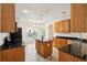 Bright kitchen boasts stainless steel appliances, central island, and granite countertops at 328 Fern House Walk, Mount Pleasant, SC 29464