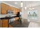Bright kitchen features stainless steel appliances, ample cabinets, and a breakfast nook at 328 Fern House Walk, Mount Pleasant, SC 29464