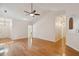 Bright living room with hardwood floors and high ceilings open to dining area at 328 Fern House Walk, Mount Pleasant, SC 29464