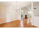 Open-concept living room and dining room with hardwood floors and fireplace feature at 328 Fern House Walk, Mount Pleasant, SC 29464