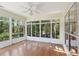 Relaxing sunroom features many windows and hardwood floors at 328 Fern House Walk, Mount Pleasant, SC 29464