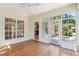 Inviting sunroom features hardwood floors and a door to the backyard at 328 Fern House Walk, Mount Pleasant, SC 29464