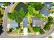An aerial shot shows a home with a pond view and lush landscaping at 352 Clayton Dr, Charleston, SC 29414