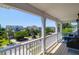 Inviting balcony offering neighborhood views of mature trees and houses on a sunny day at 352 Clayton Dr, Charleston, SC 29414