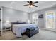 Cozy bedroom featuring tray ceilings, neutral walls, carpet floors, and a door to the outside at 352 Clayton Dr, Charleston, SC 29414