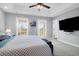 Cozy bedroom featuring tray ceilings, neutral walls, carpet floors, and a door to the outside at 352 Clayton Dr, Charleston, SC 29414