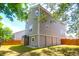 Rear exterior view of a two-story home with a fenced yard, and a view of the neighborhood at 352 Clayton Dr, Charleston, SC 29414