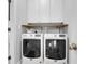 Functional laundry area equipped with modern washer and dryer units and overhead cabinets for storage at 352 Clayton Dr, Charleston, SC 29414