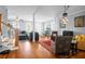 Inviting living room with hardwood flooring, a decorative ceiling fan and an abundance of light at 352 Clayton Dr, Charleston, SC 29414