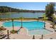 Overhead view of a modern community pool, complemented by palm trees and lounge chairs at 3894 Summerton St, Mount Pleasant, SC 29466