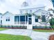 Charming home exterior with a screened porch, landscaped yard, and an inviting front entrance, perfect for curb appeal at 3894 Summerton St, Mount Pleasant, SC 29466
