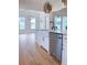 Spacious kitchen with white cabinetry, farmhouse sink, and stainless steel appliances at 3894 Summerton St, Mount Pleasant, SC 29466
