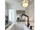 Bright kitchen with white countertops, stainless steel appliances, and modern black faucet; a culinary dream at 3894 Summerton St, Mount Pleasant, SC 29466