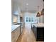 Beautiful kitchen featuring granite countertops, stainless steel appliances, and a farmhouse sink with stylish faucet at 3894 Summerton St, Mount Pleasant, SC 29466
