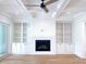 Cozy living room with fireplace, built-in shelving, and hardwood floors at 3894 Summerton St, Mount Pleasant, SC 29466