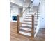 Elegant staircase with wood and white accents, leading to upper levels at 3894 Summerton St, Mount Pleasant, SC 29466
