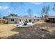 Spacious backyard with a concrete patio and fire pit, perfect for outdoor entertaining and relaxation at 402 Woodward Blvd, Summerville, SC 29483