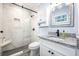 Stylish bathroom featuring a shower with white marble tiling and granite countertop at 402 Woodward Blvd, Summerville, SC 29483